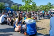 Runners enjoy a moment of relaxation in the sun after the race.