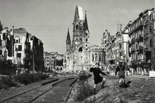 Memorial. In post-war Berlin, children played in front of the ruins of the Kaiser Wilhelm Memorial Church on the destroyed Tauentzienstrasse.
