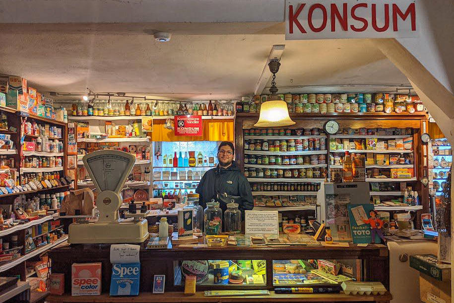 Public history student Thomas Köhler is specializing in the GDR’s history as told through material culture. Here he can be seen in a reconstruction of a grocery store at the GDR Documentation Center in Perleberg.