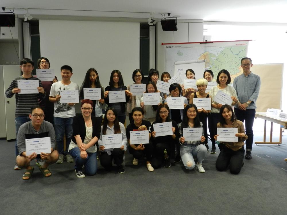 Group picture with certificates.