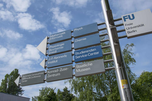 Signs pointing to the academic departments and institutes on the Dahlem campus